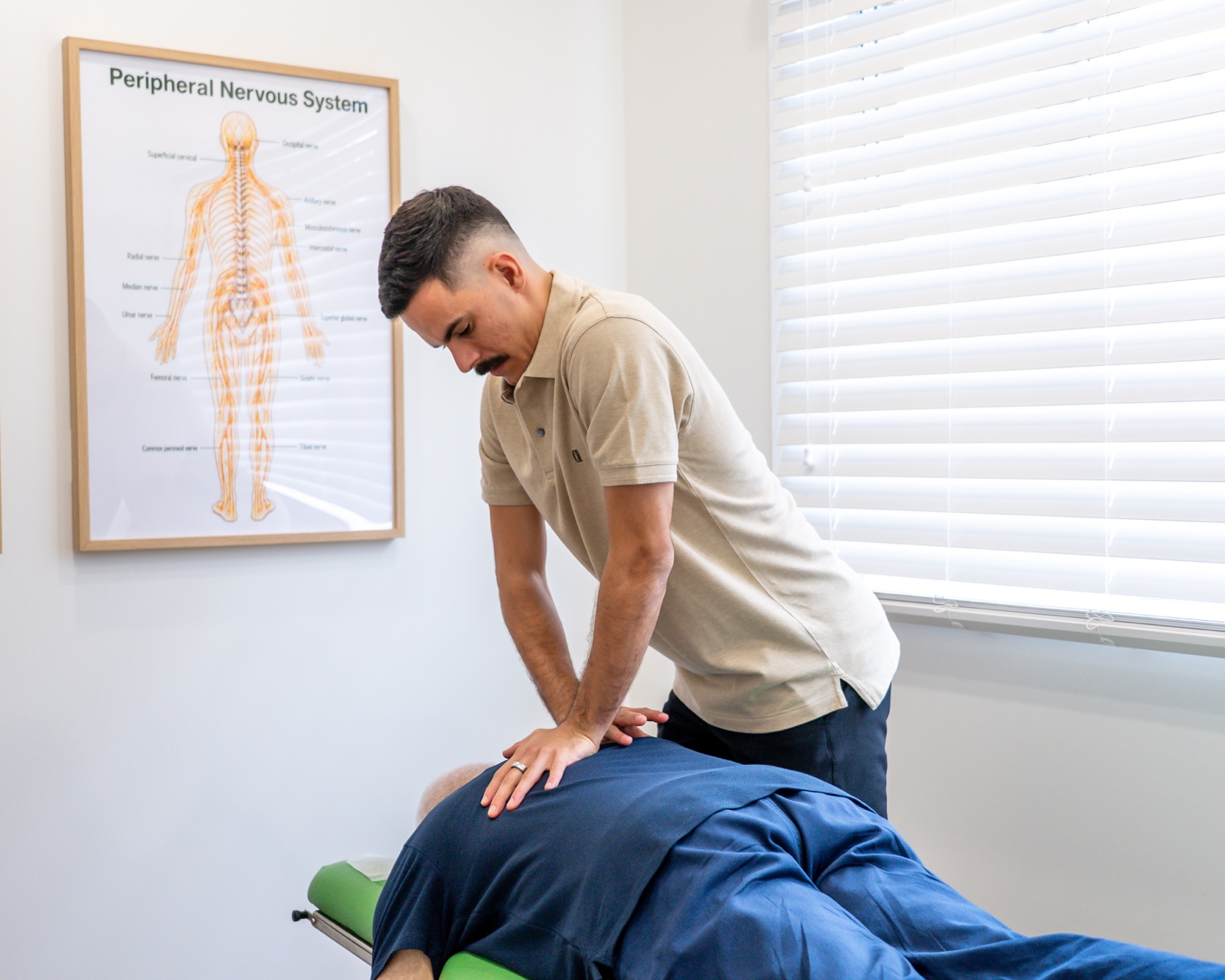 Alma Health chiropractor providing chiropractic care to a patient